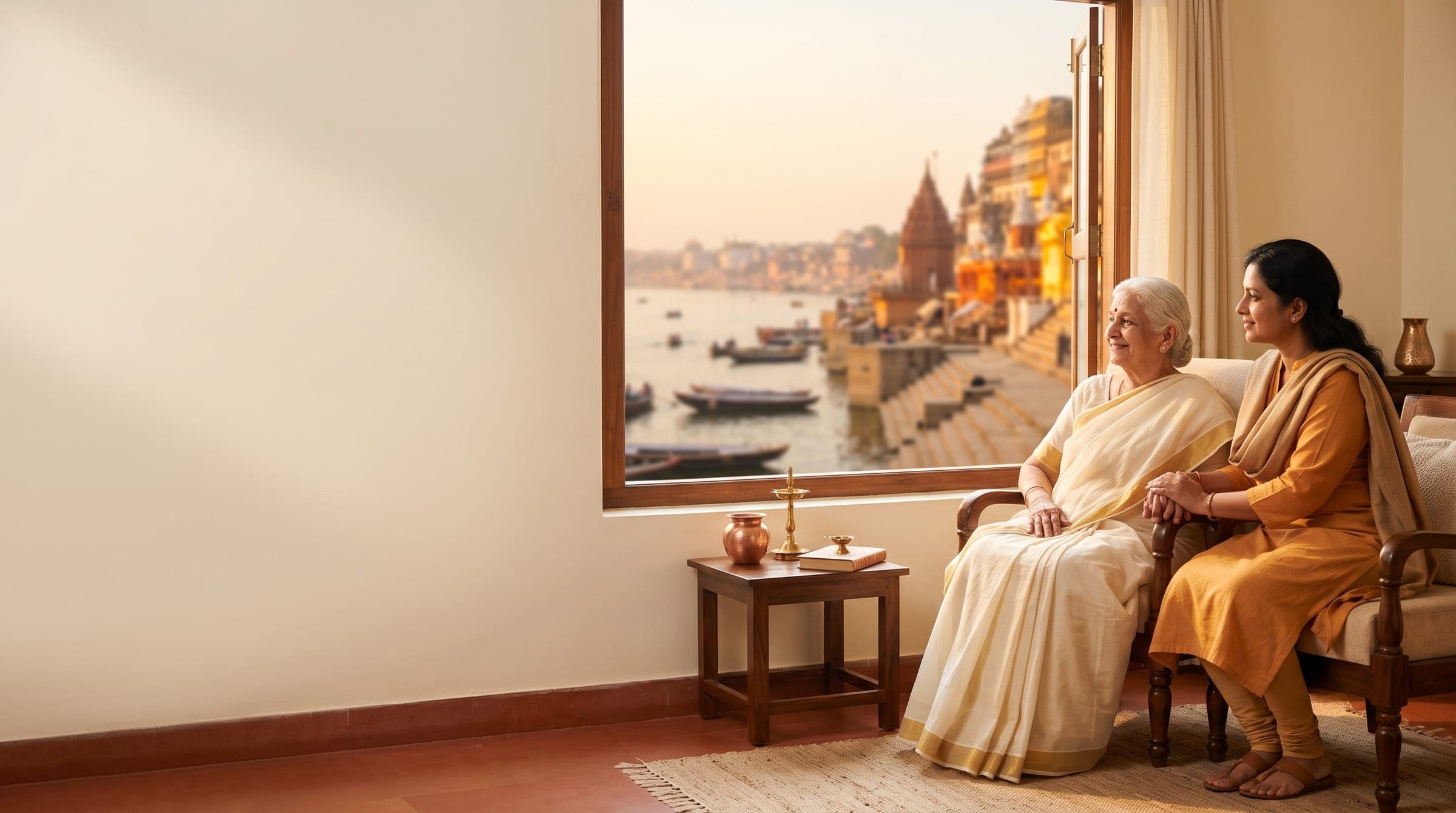 An elderly resident and her daughter sitting together at Dinesh Kiran Kashi Laabh in Kashi